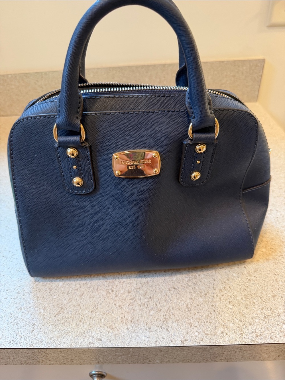 Women’s Michael Kors navy blue handbag,